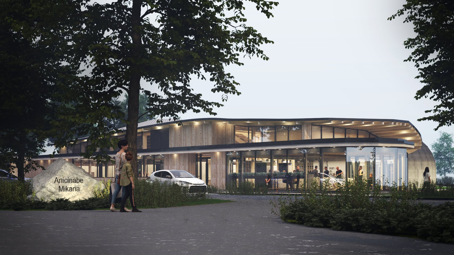 A modern, two story wood clad building with curved glass walls inspired by the traditional wigwam used by the Algonquin people.