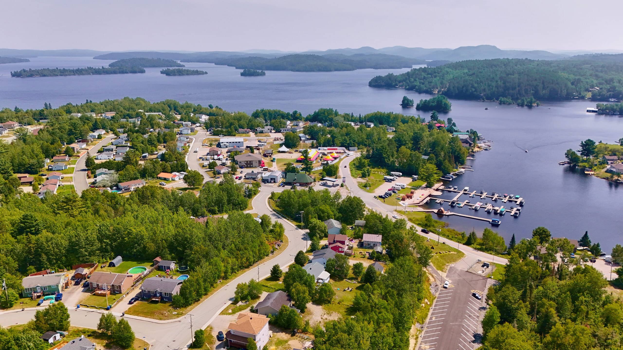 An aerial view of Kebaowek First Nation with the immensity of Lake Kipawa in the background.